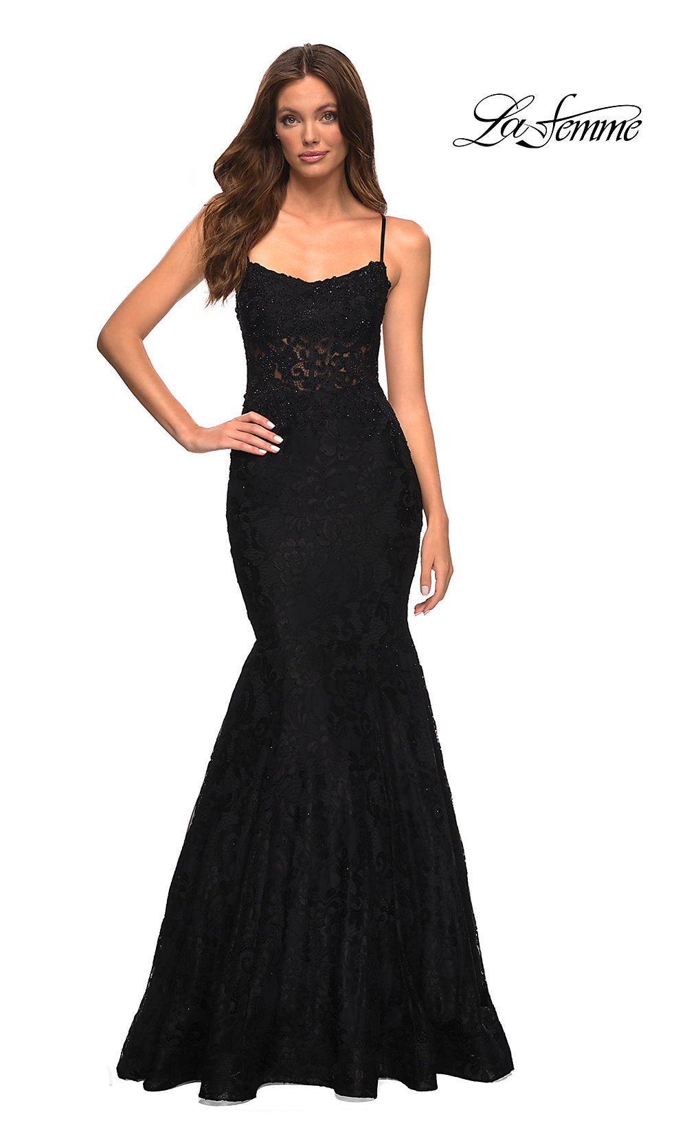 A woman models the Open-Back Long Lace Mermaid Prom Dress by La Femme in black, standing with one hand on her hip against a white background. The La Femme logo appears in the top right corner.